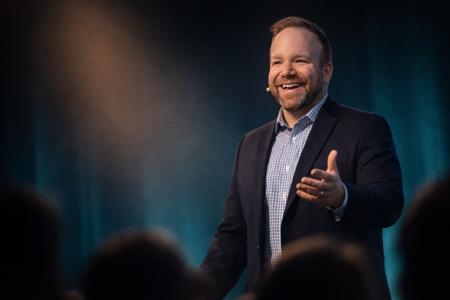 Sam Linton speaking on stage