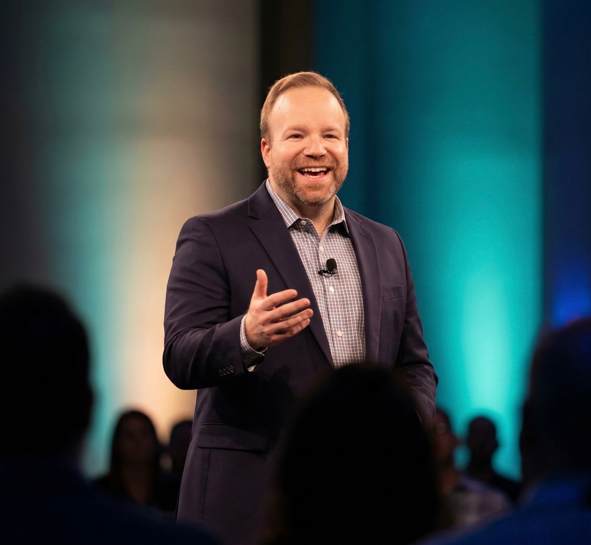 Sam Linton speaking on stage